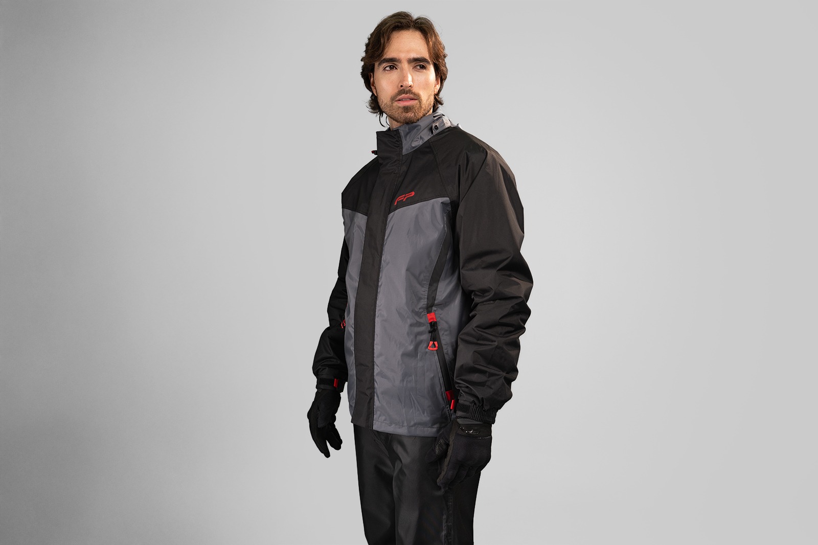 Impermeable touring negro para motociclistas con estilo deportivo