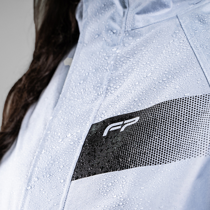 impermeable de mujer con chaqueta con reflectivos color azul FP Tornado