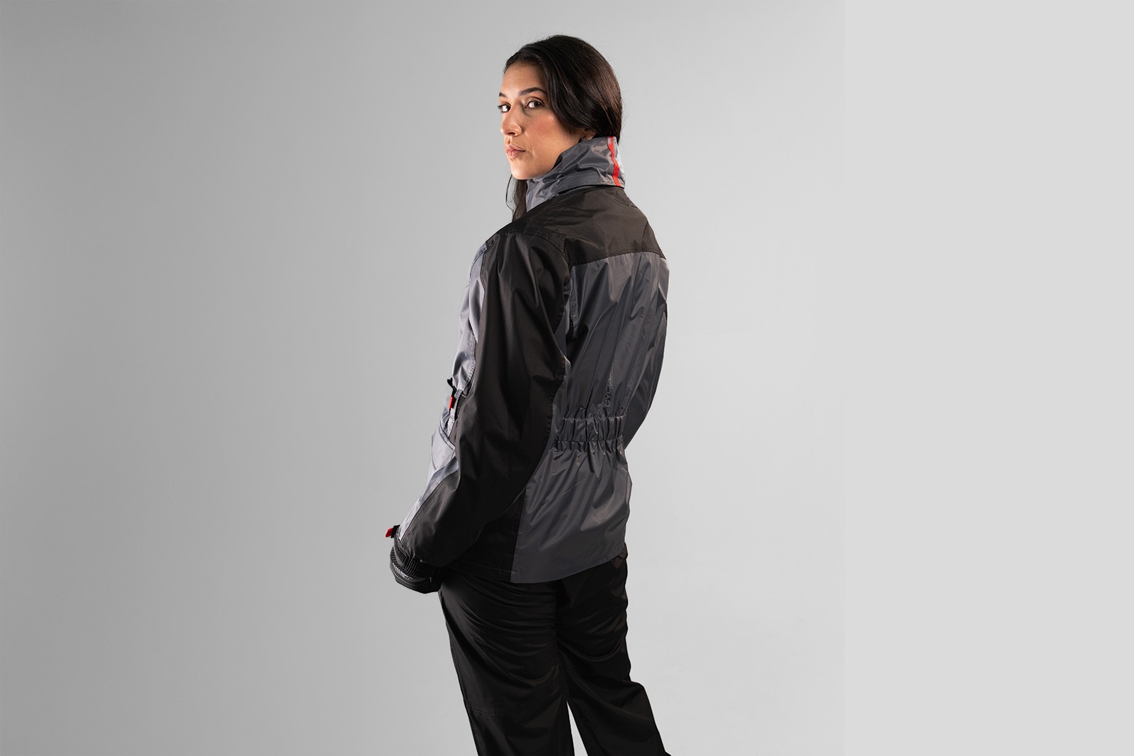Espalda con elástico anatómico del impermeable FP para dama